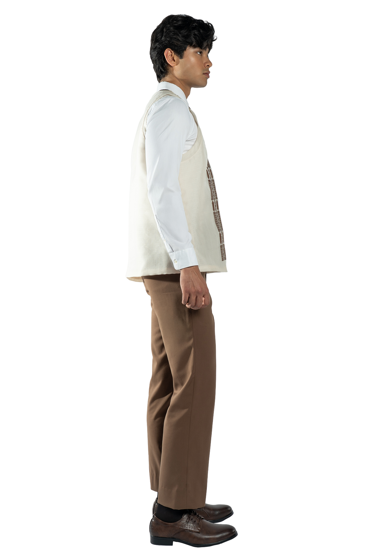 Man wearing a white shirt, beige vest, and brown pants on a white background