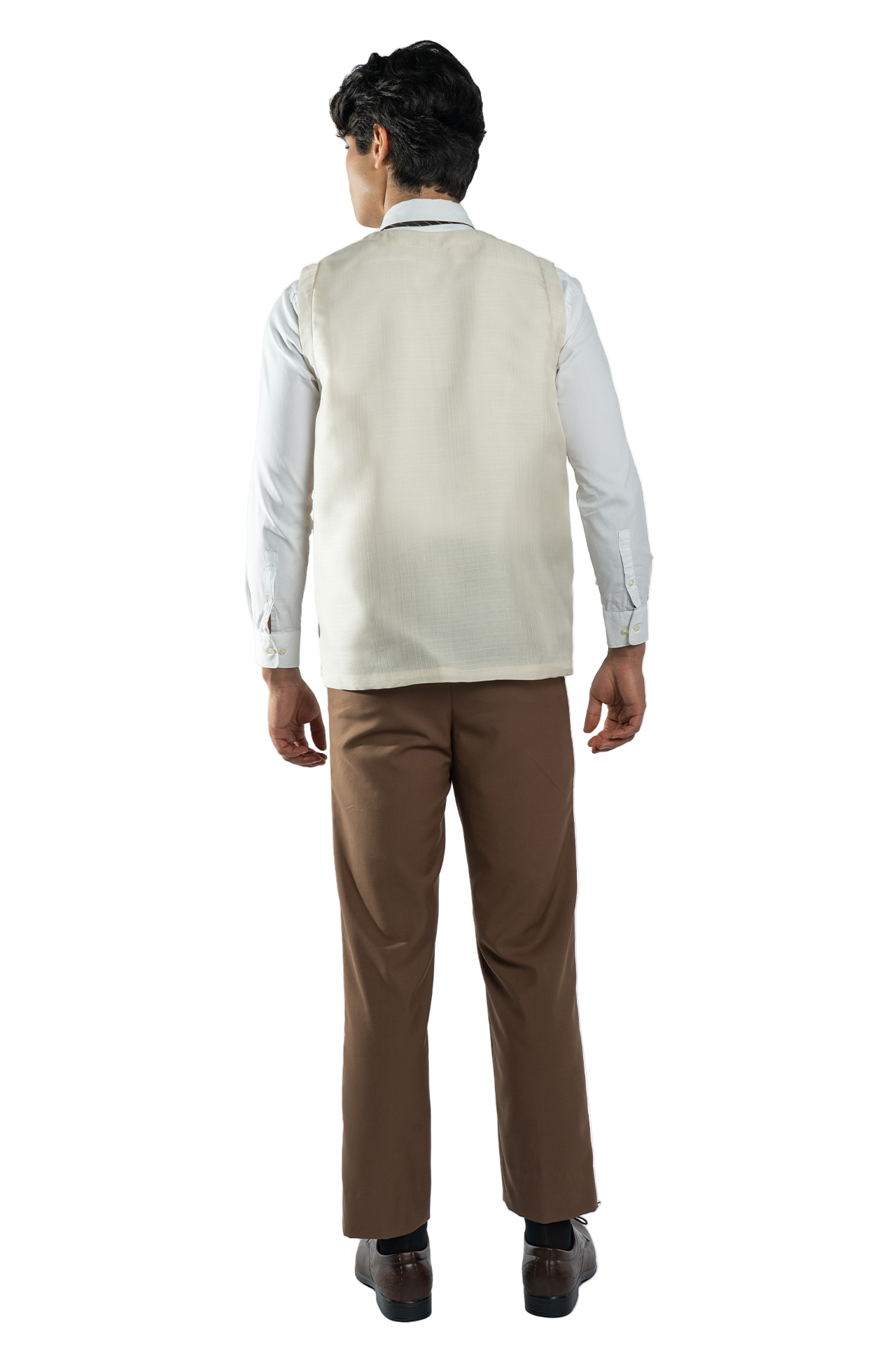 Man wearing a white shirt, beige vest, and brown pants on a white background