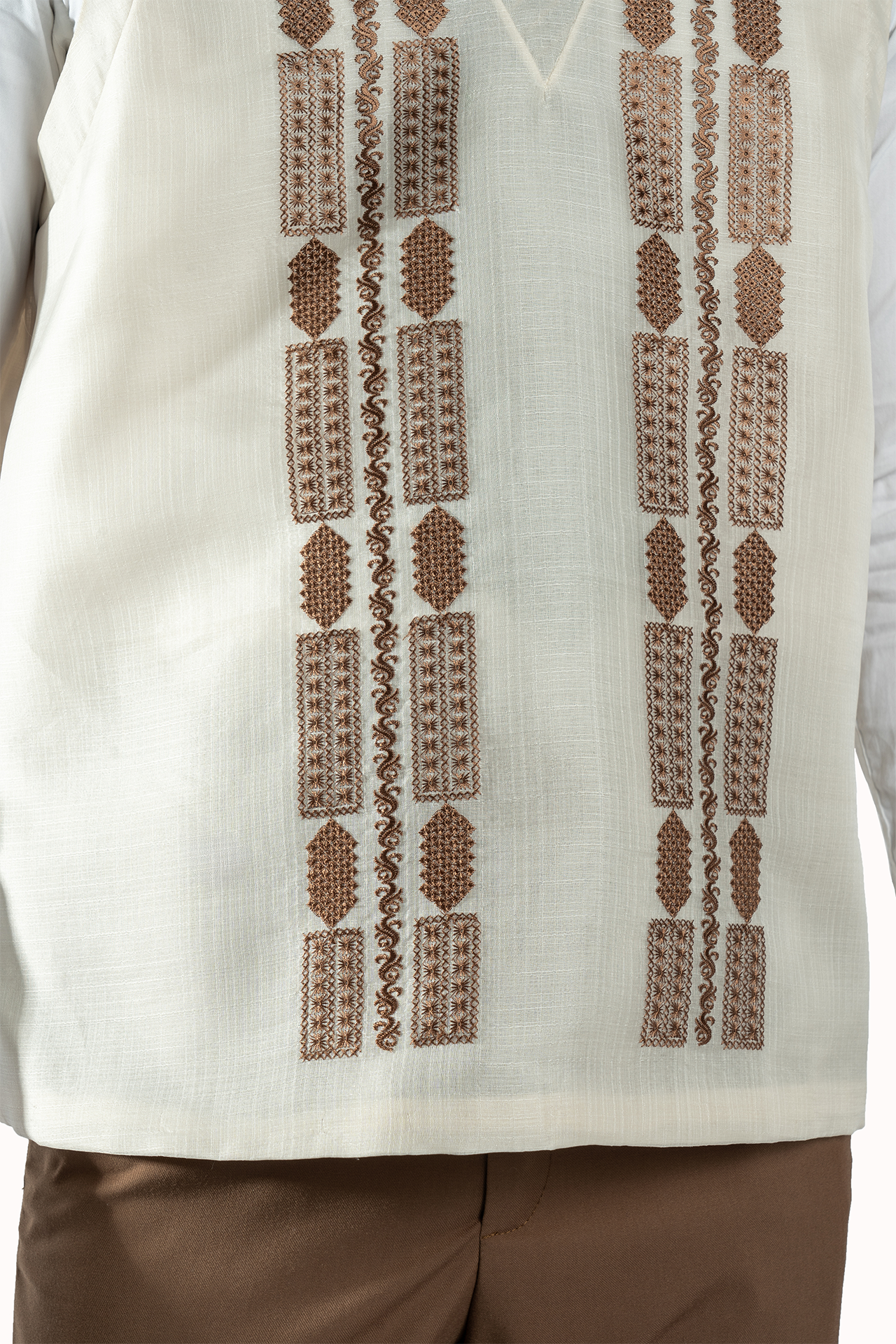 White shirt with brown geometric patterns on a white background
