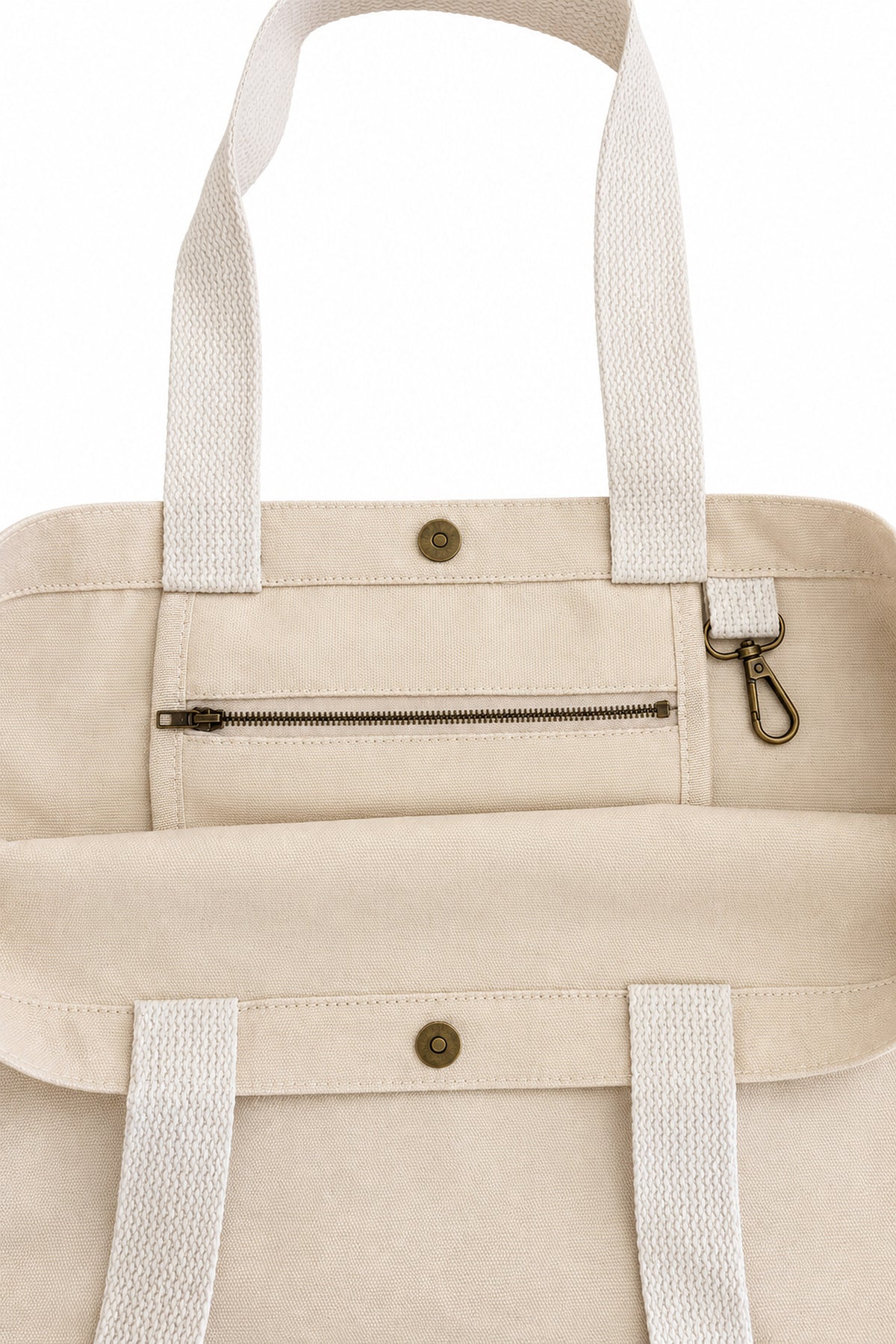 Inside of The House Tote showing zip pocket, aged brass key hook and magnetic snap closure