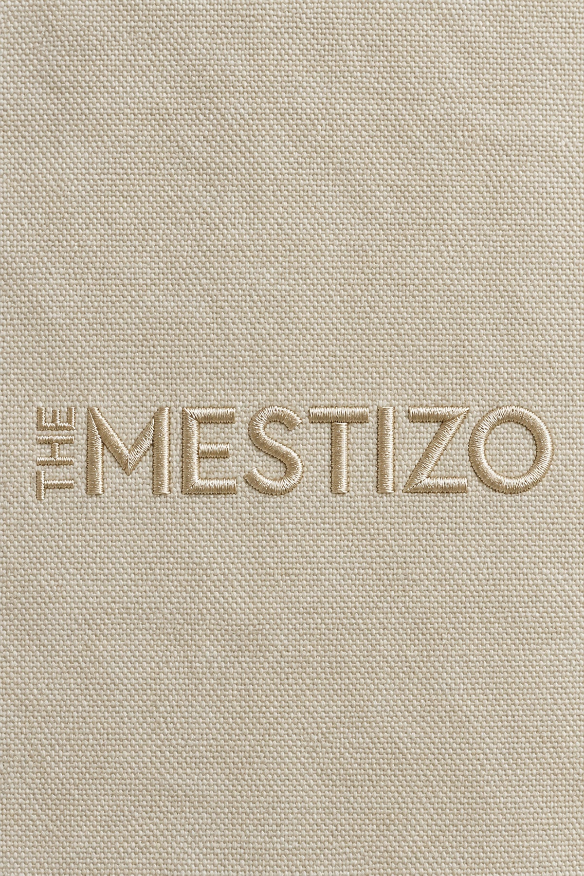 Tonal embroidered The Mestizo wordmark on 12 oz cotton canvas